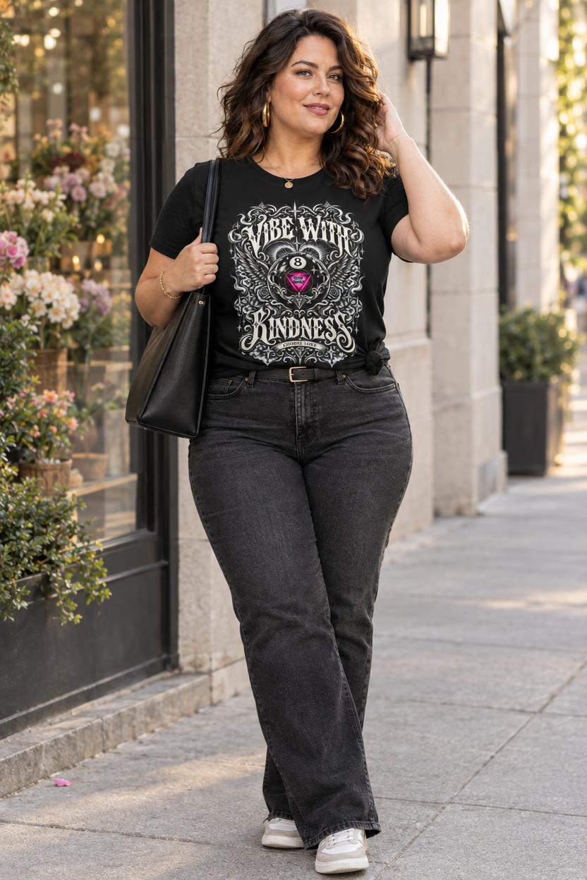 Model wearing the Black ornate 8-ball graphic tee with wide-leg jeans and a shoulder bag on a sidewalk.